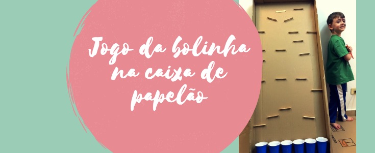 Jogo da bolinha na caixa de papelão